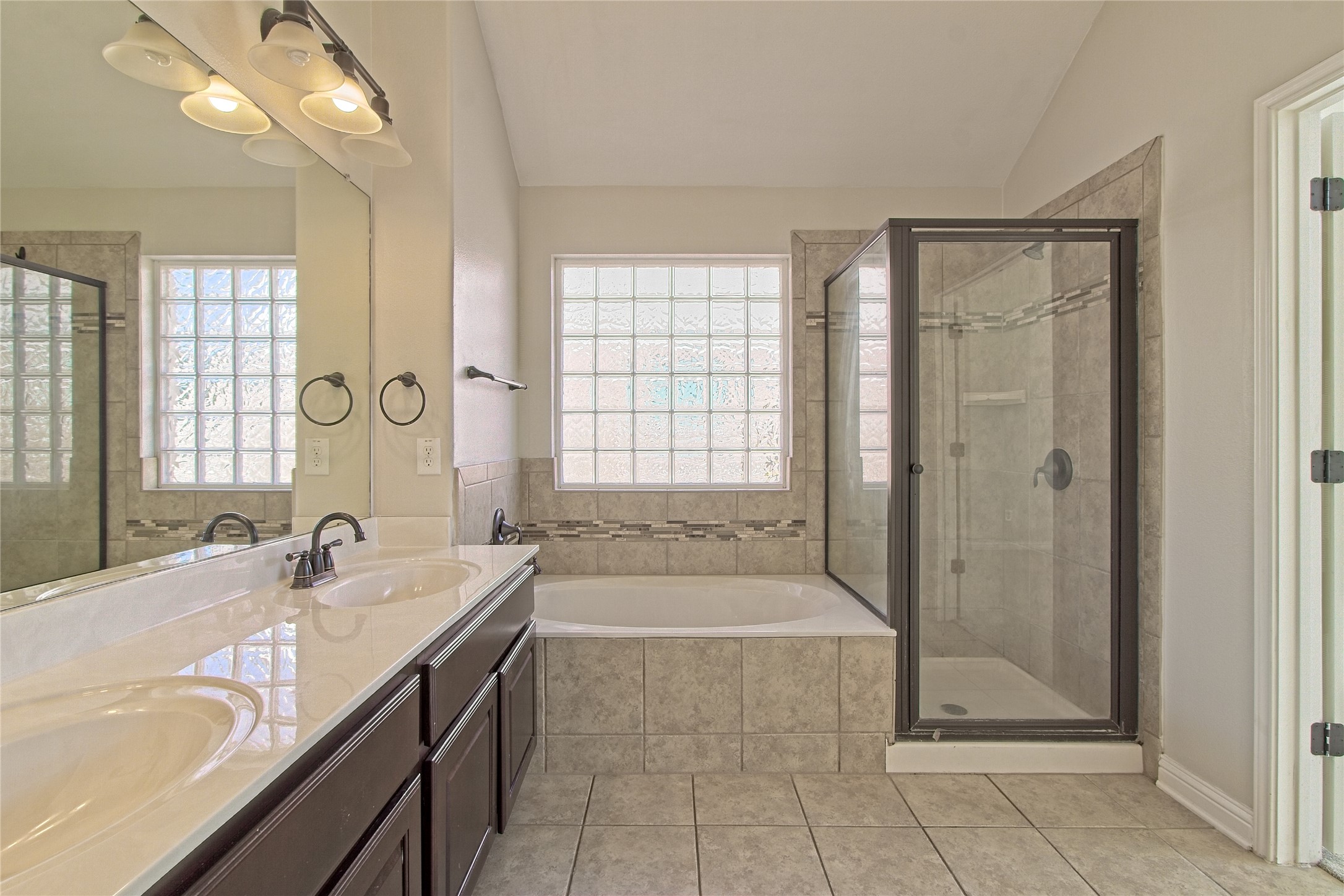 3618 Penelope Way Round Rock, TX 78665 - Photo 20 of 36 a bathroom with a tub a sink and a shower
