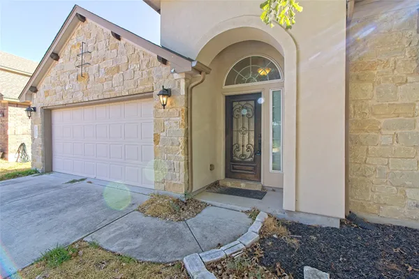 a view of a wooden door of a house