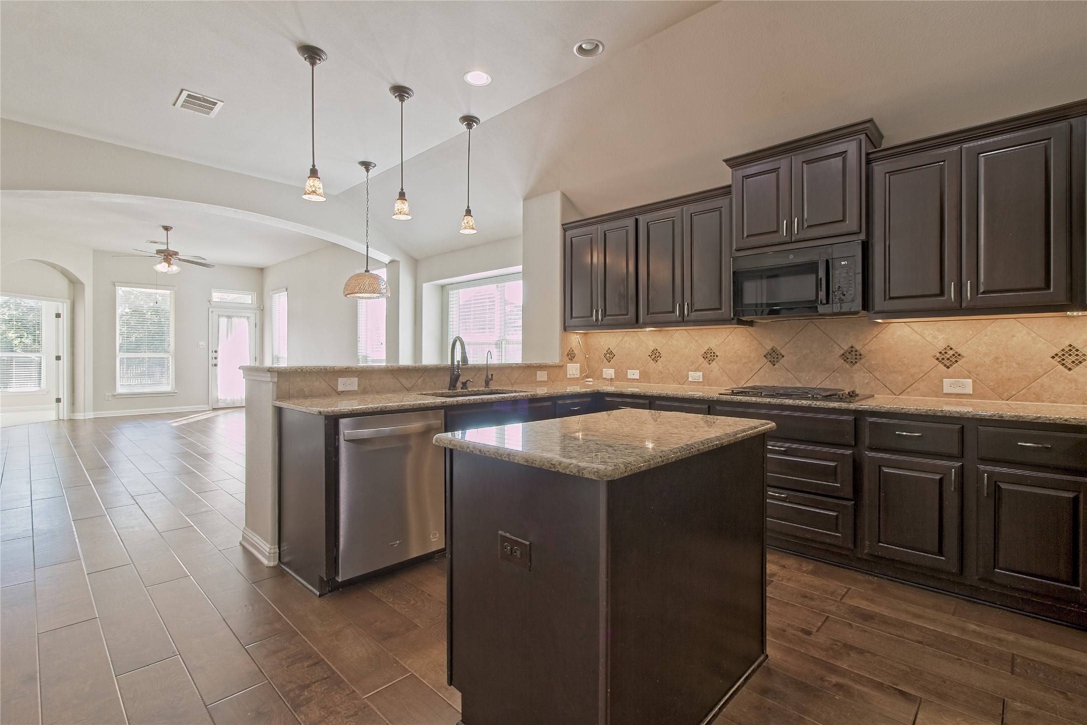 3618 Penelope Way Round Rock, TX 78665 - Photo 36 of 36 a kitchen with stainless steel appliances granite countertop a sink stove and cabinets