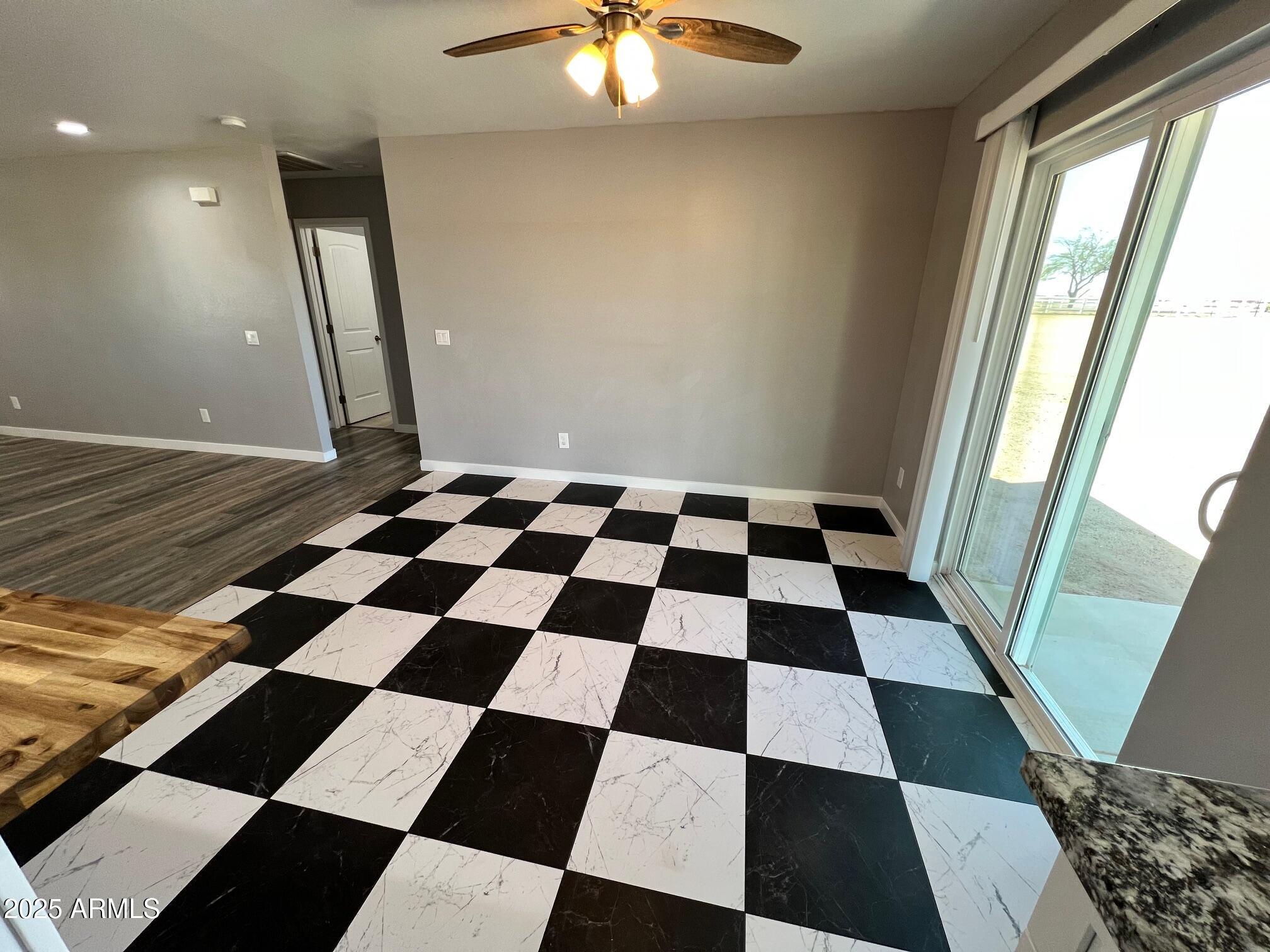 4552 North Loring Road Casa Grande, AZ 85194 - Photo 11 of 48 a black and white checkered floor