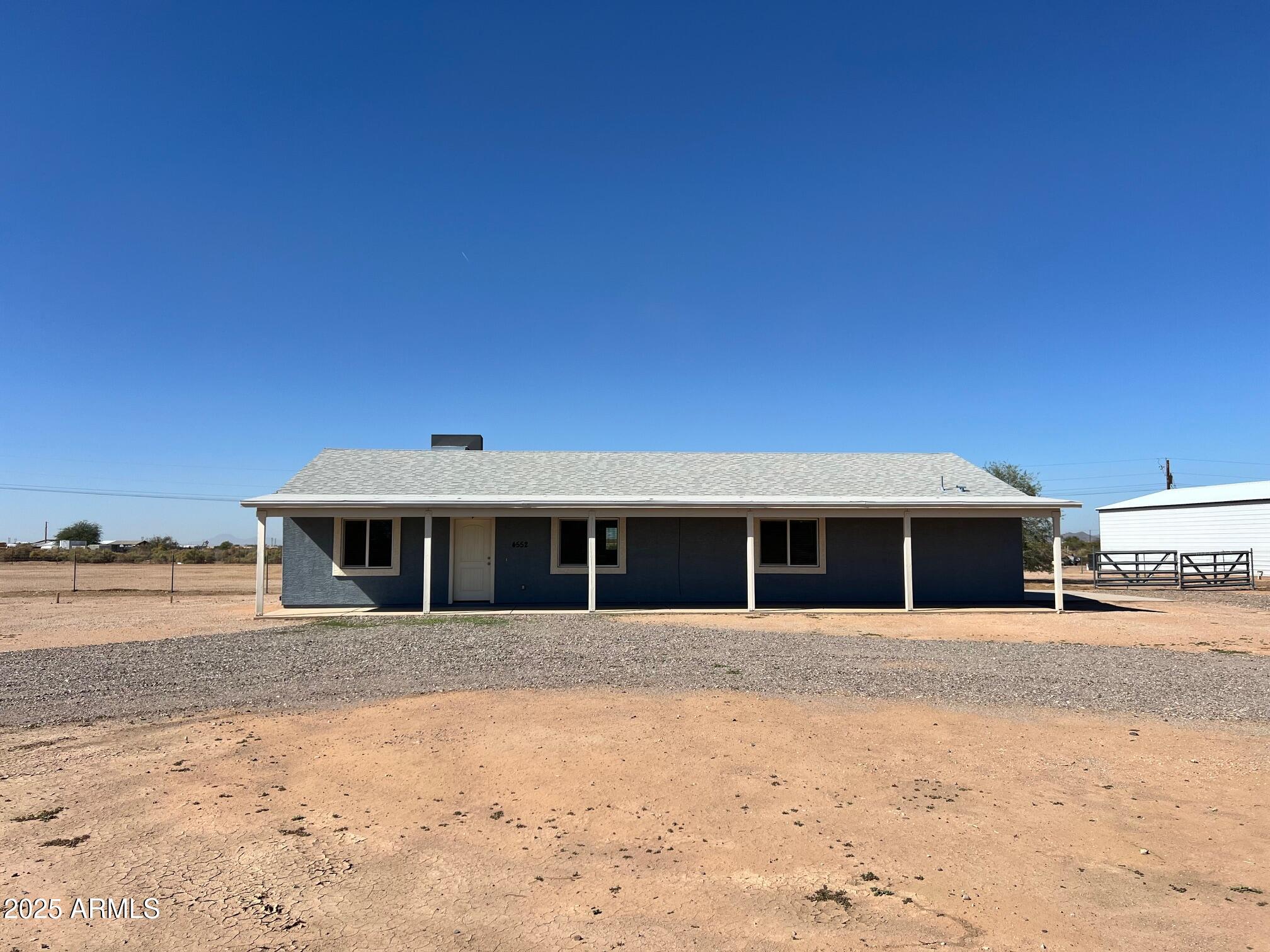 4552 North Loring Road Casa Grande, AZ 85194 - Photo 45 of 48 a front view of a house with a yard