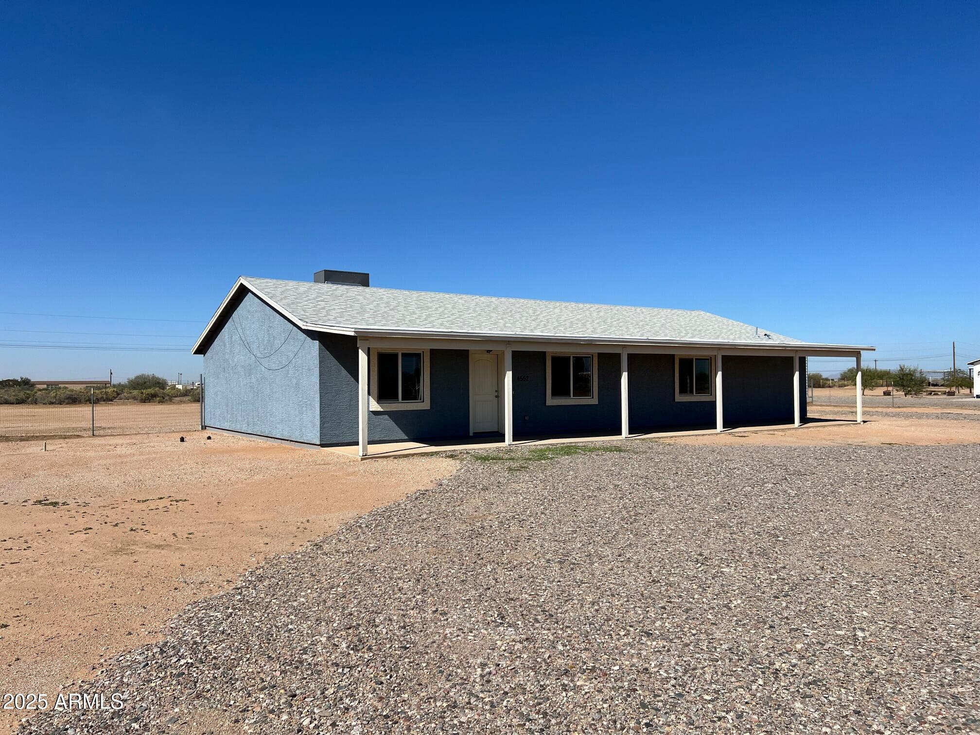 4552 North Loring Road Casa Grande, AZ 85194 - Photo 46 of 48 a front view of a house with a yard