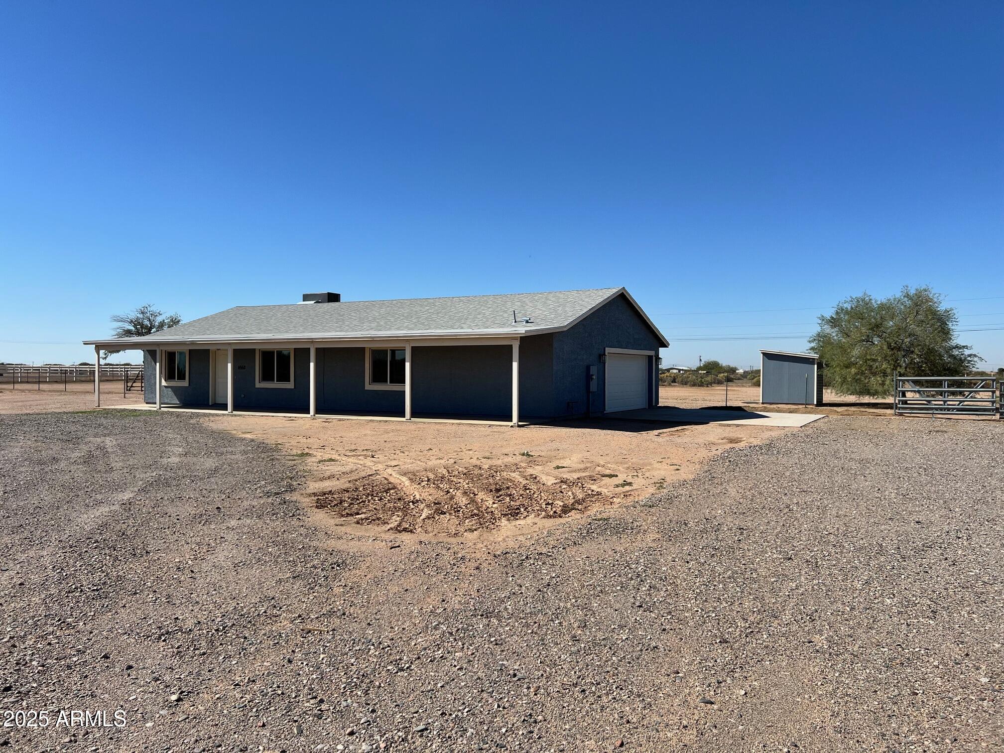 4552 North Loring Road Casa Grande, AZ 85194 - Photo 47 of 48 a front view of a house with a yard