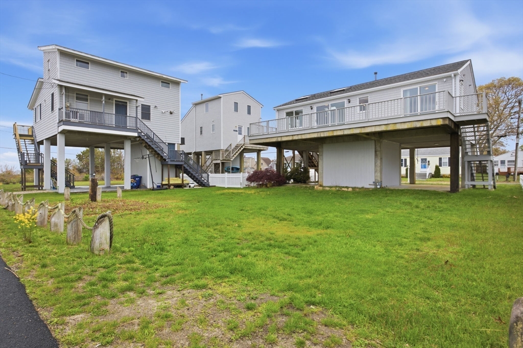 192 Swifts Beach Road Wareham, MA 02571 - Photo 11 of 38 a view of a house with a yard