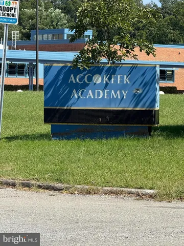 a view of garden with wooden fence