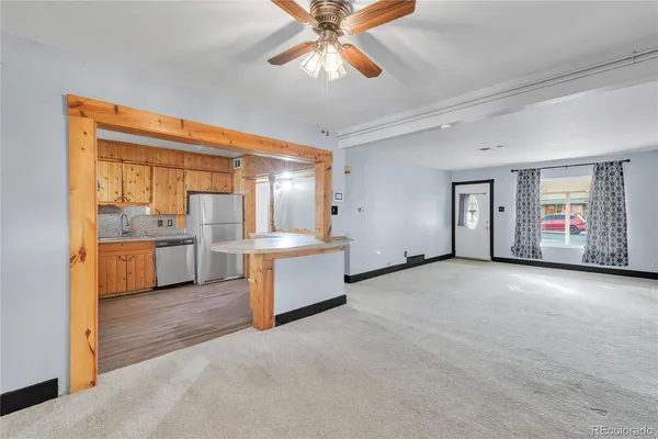 a view of a kitchen with a sink and a window