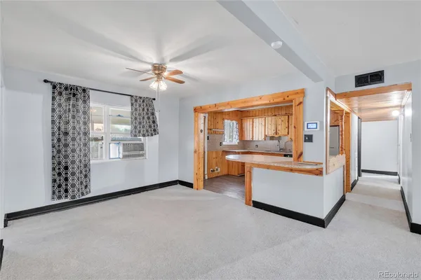 a view of living room with furniture and flat screen tv