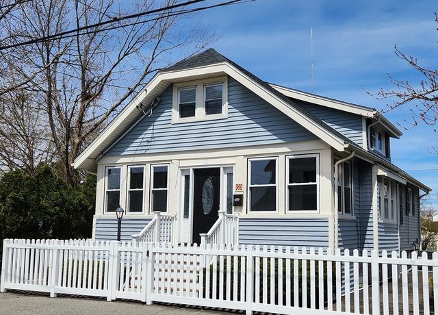 a front view of a house with a porch