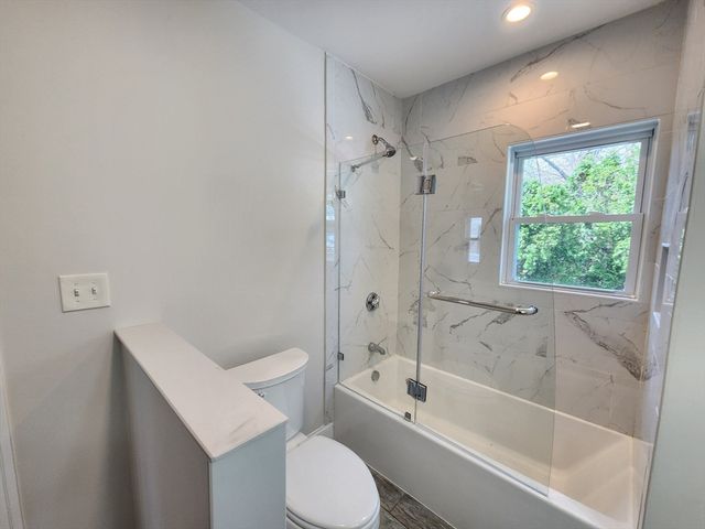 a bathroom with a sink toilet and bathtub