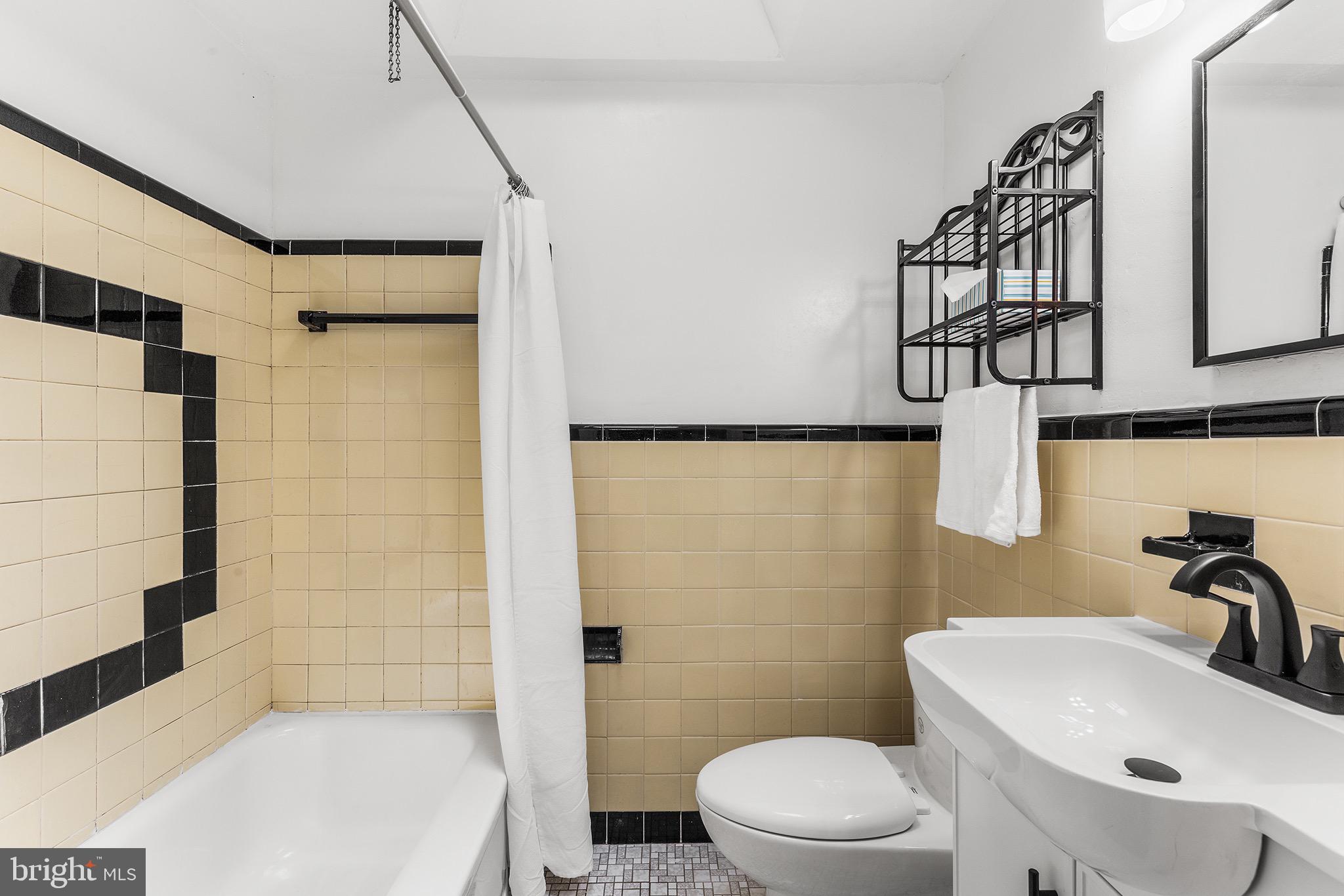 390 Glen Cove Road Collingdale, PA 19023 - Photo 22 of 27 a bathroom with a sink a toilet and shower