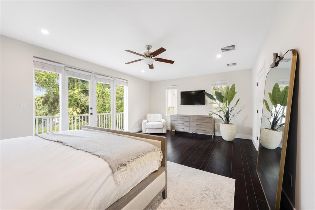 834 Southwest 16th Street Fort Lauderdale, FL 33315 - Photo 13 of 26 a bedroom with a large bed and a large window