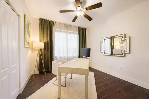 a workspace with furniture and window