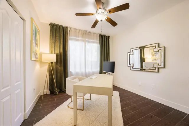 a workspace with furniture and window