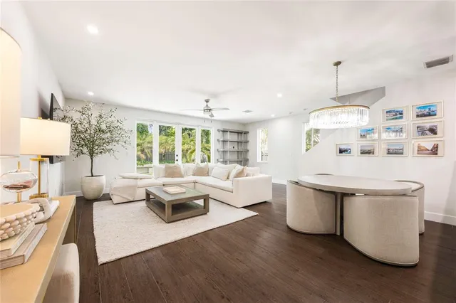 a living room with furniture a table and decor