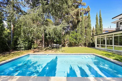 a view of a swimming pool with an outdoor space