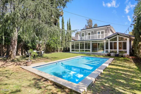 a view of a house with swimming pool
