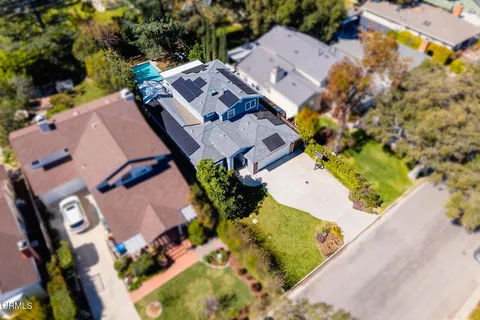 an aerial view of residential house with outdoor space