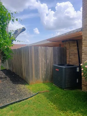 a view of a house with garden and yard