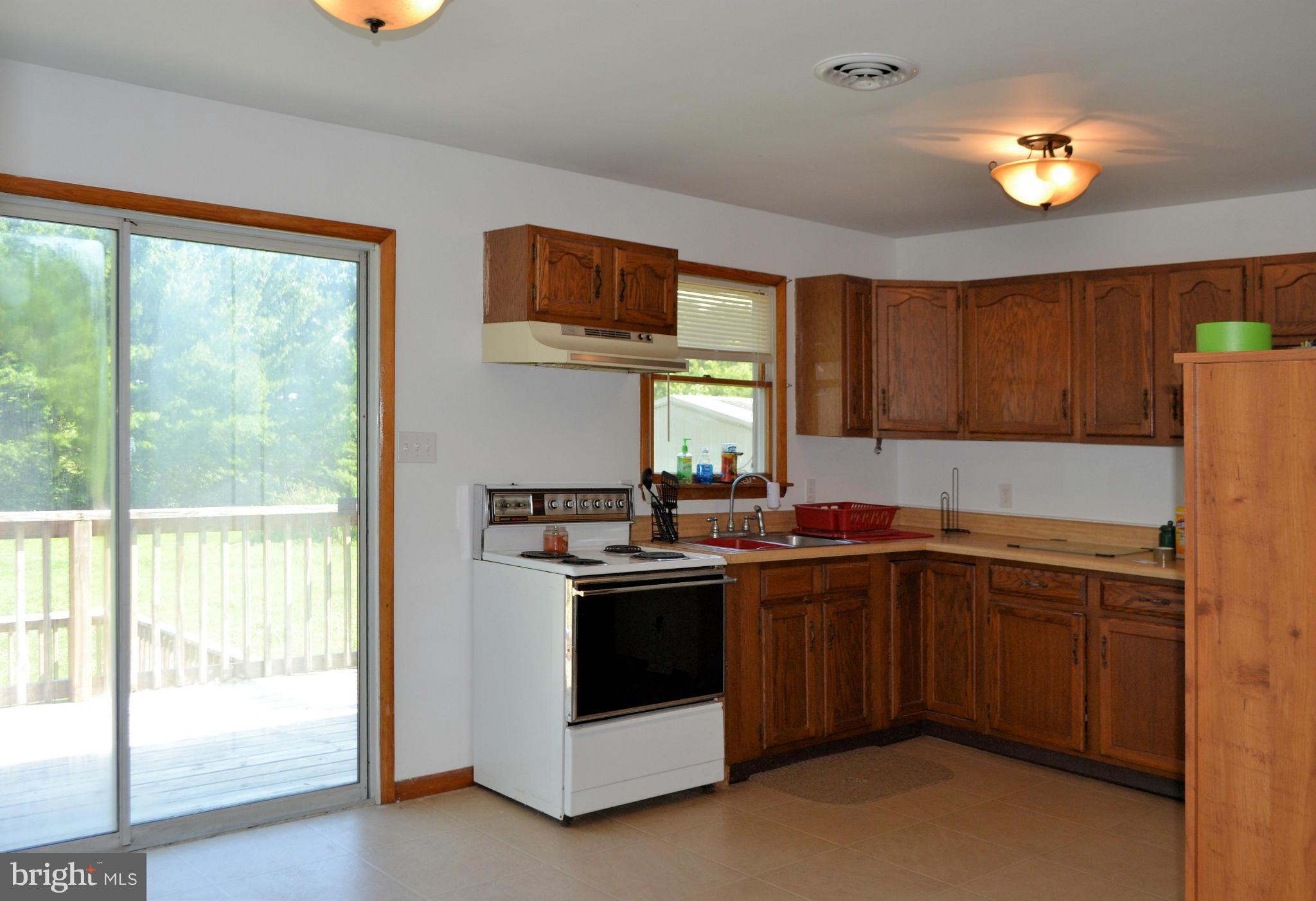 920 Ragan Road Conowingo, MD 21918 - Photo 17 of 30 Kitchen has sliders to tiered deck