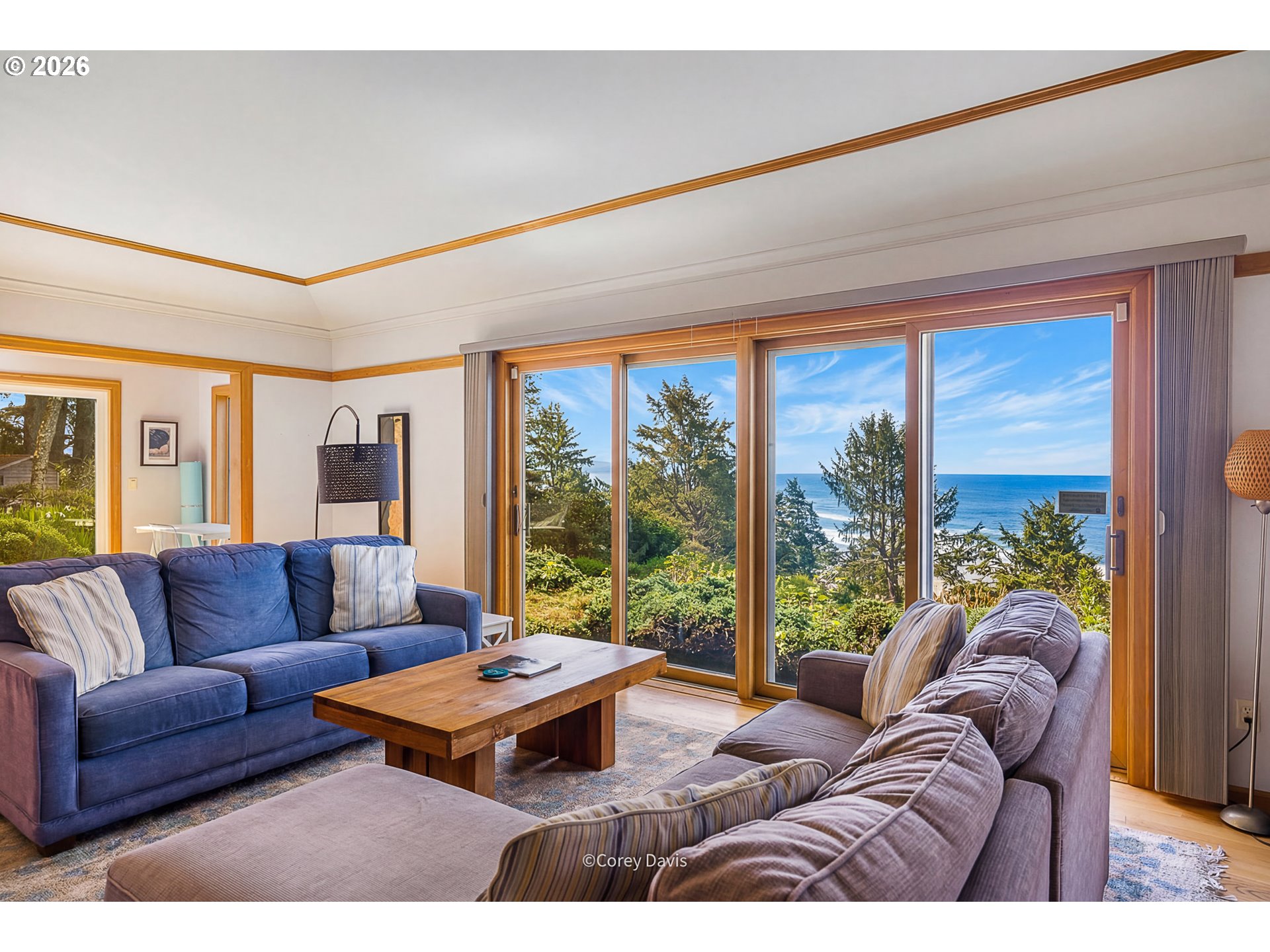 38295 Beulah Reed Road Nehalem, OR 97131 - Photo 11 of 42 a living room with furniture and a large window