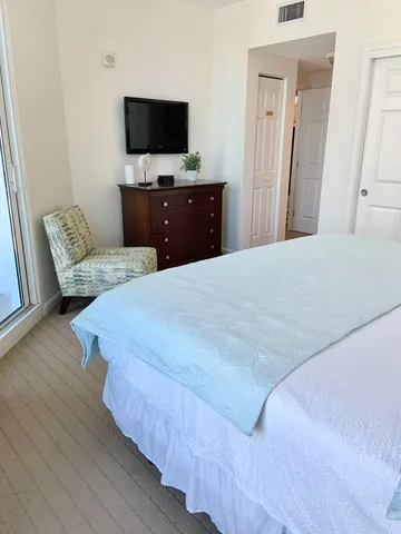 a kitchen with a sink a stove top oven and cabinets