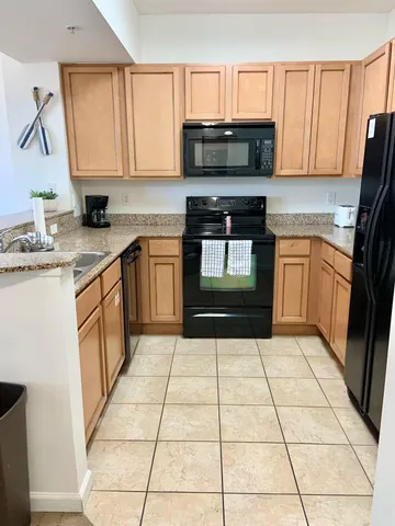 a living room with couches and painting on the wall