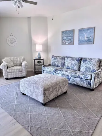 a living room with furniture and a table