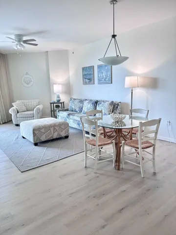 a view of a house with a yard and potted plants
