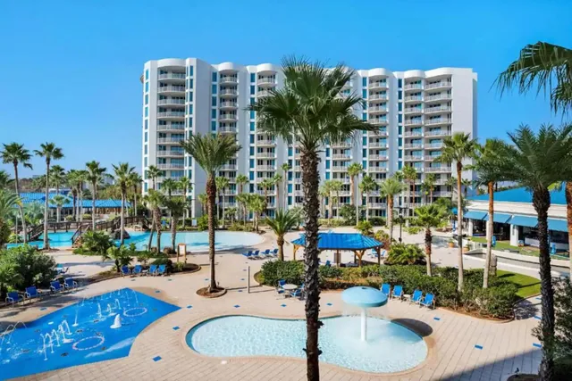 a living room with fireplace furniture and a wooden floor
