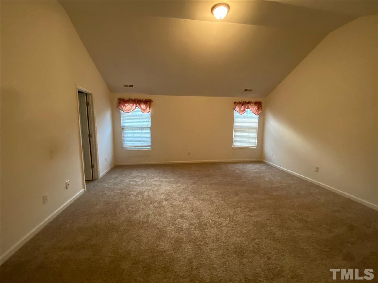 4165 Dalcross Road Raleigh, NC 27610 - Photo 14 of 28 an empty room with windows