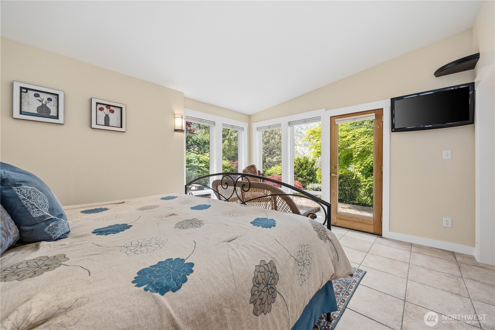 141 Sunset Place Manson, WA 98831 - Photo 24 of 38 a bedroom with a bed and large windows