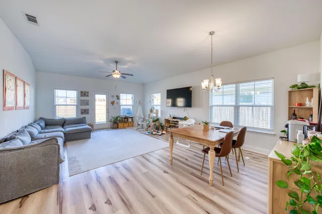 a kitchen with stainless steel appliances granite countertop a stove refrigerator and cabinets