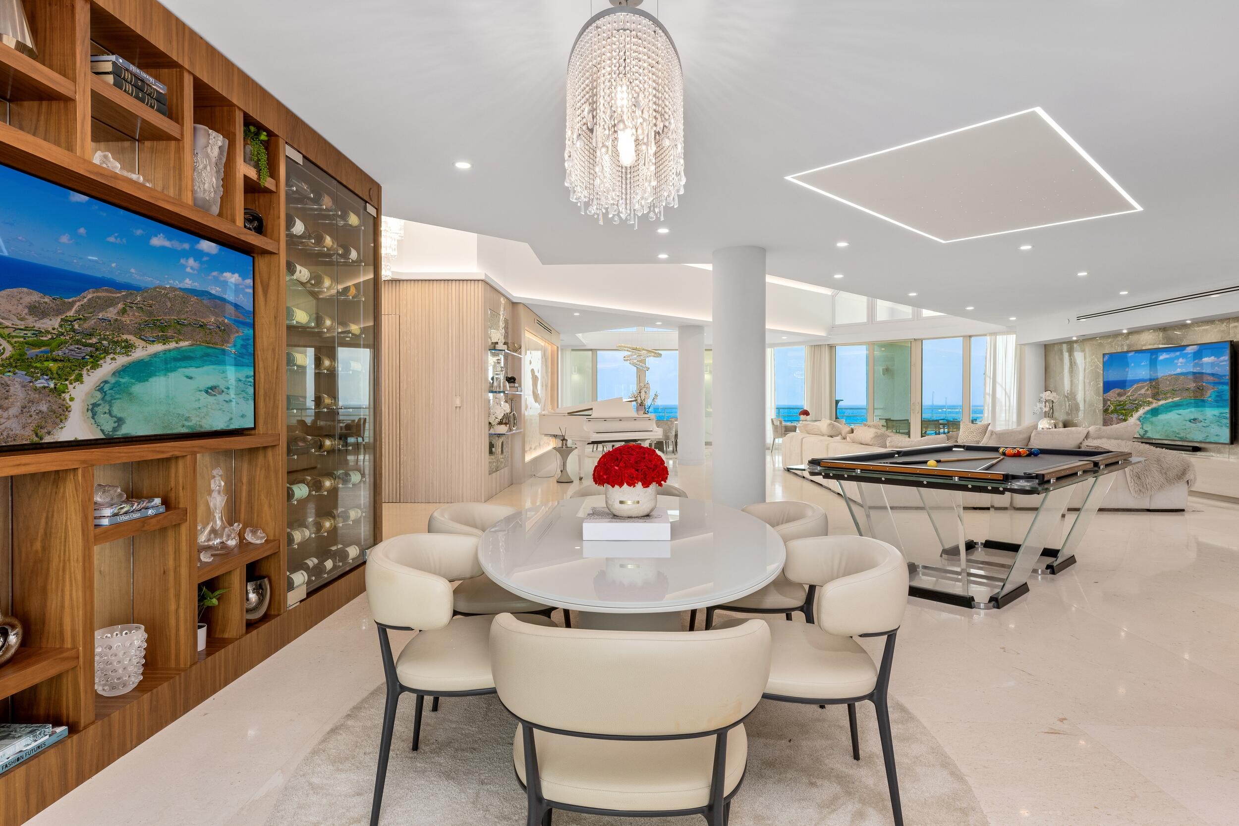 800 South Ocean Boulevard, Unit PH6 Boca Raton, FL 33432 - Photo 14 of 69 a kitchen with a dining table and chairs