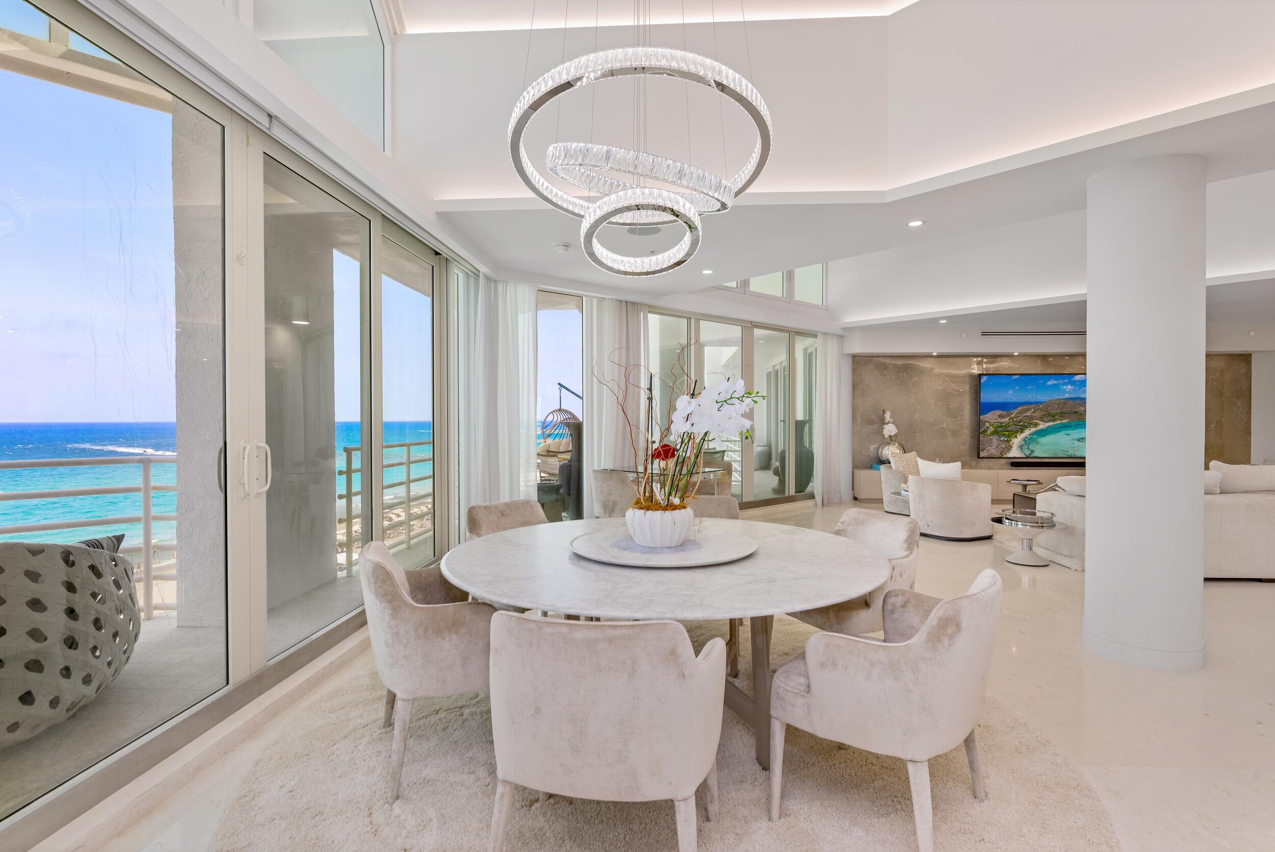 800 South Ocean Boulevard, Unit PH6 Boca Raton, FL 33432 - Photo 15 of 69 a view of a dining room with furniture and a large window