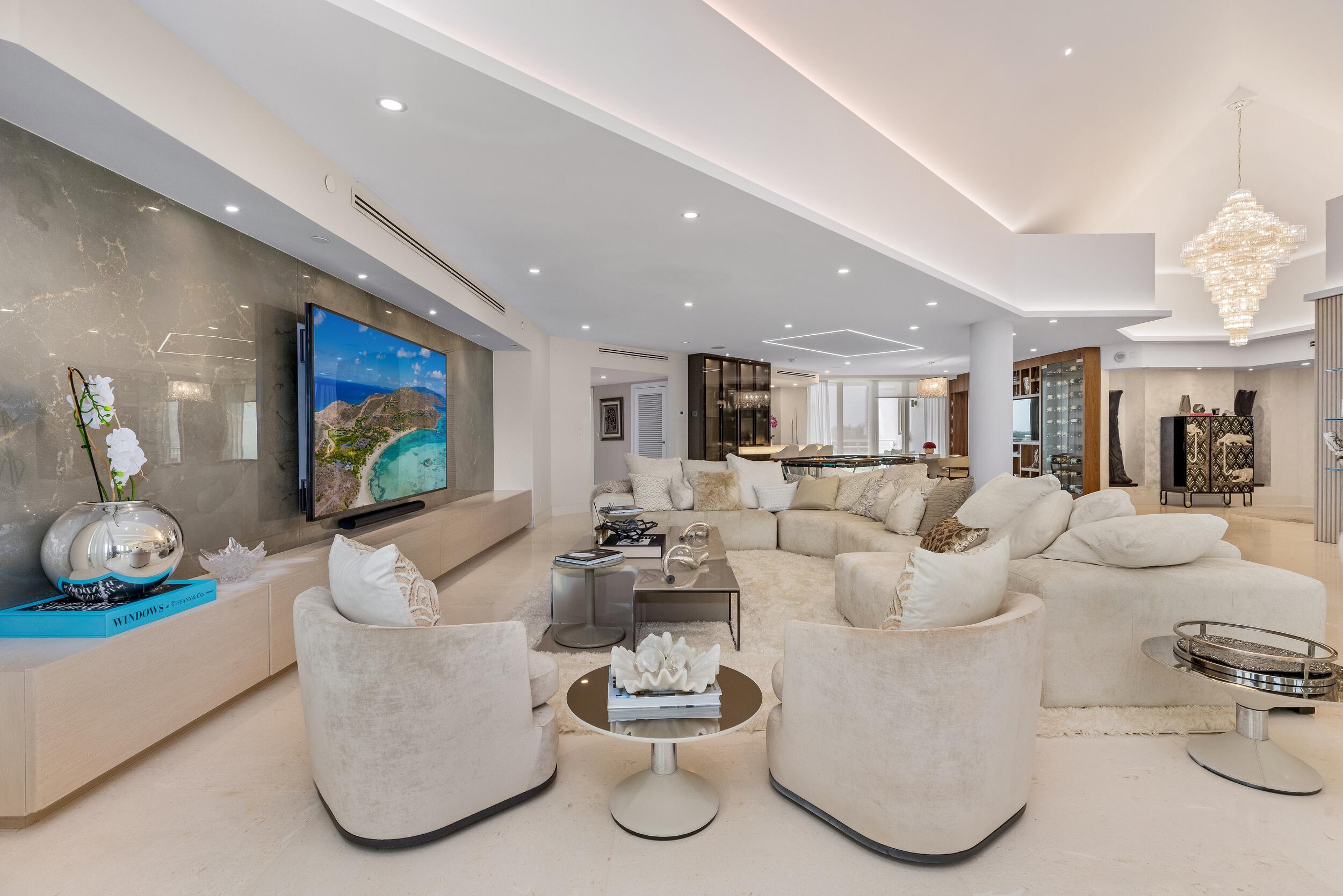 800 South Ocean Boulevard, Unit PH6 Boca Raton, FL 33432 - Photo 23 of 69 a living room with furniture and a flat screen tv