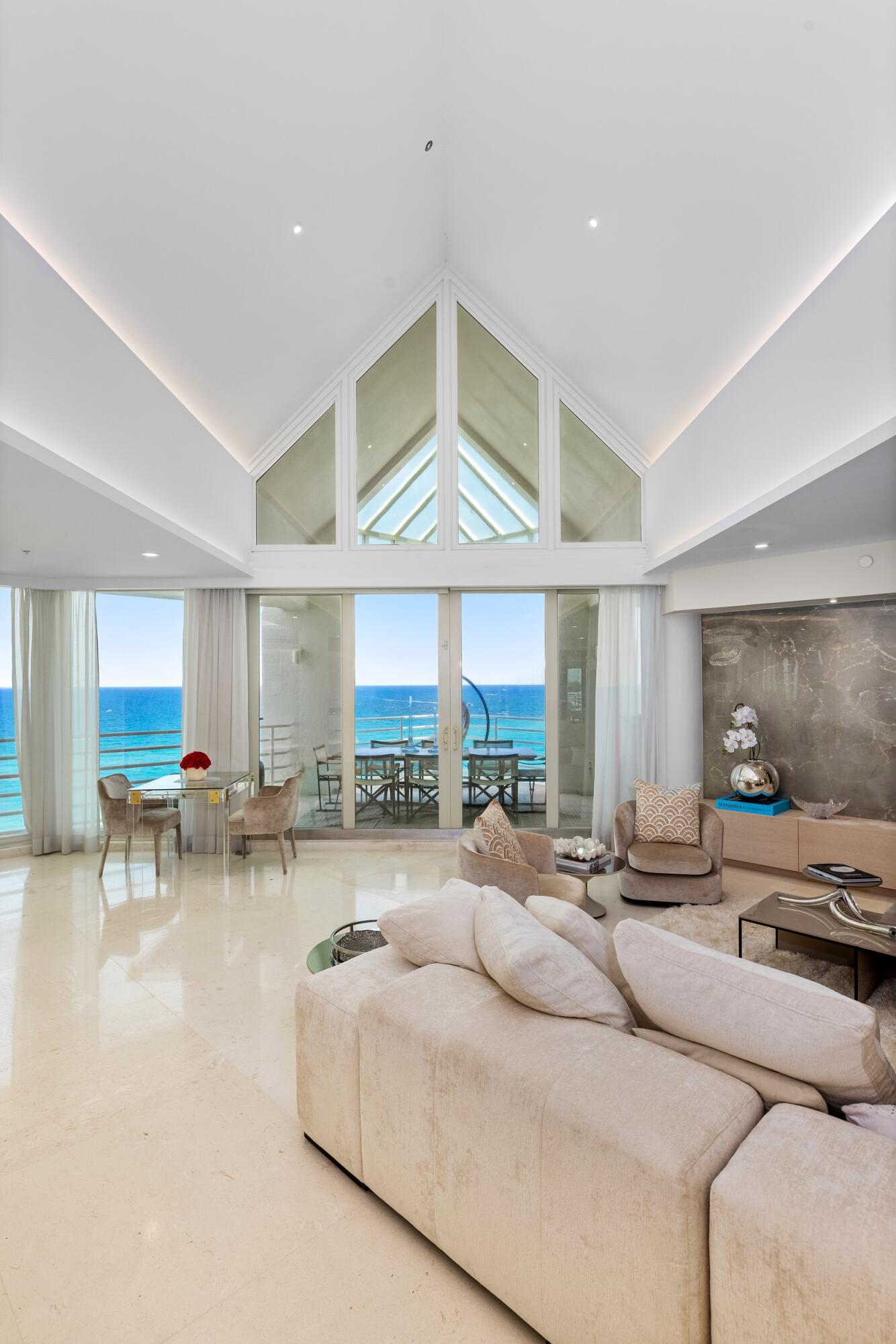 800 South Ocean Boulevard, Unit PH6 Boca Raton, FL 33432 - Photo 29 of 69 a very nice looking living room with a large window and a table