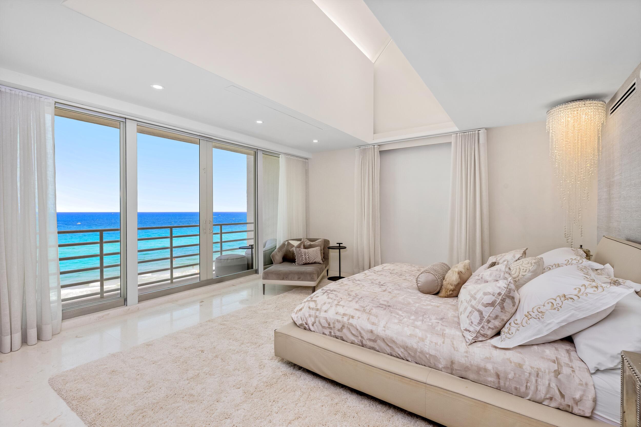 800 South Ocean Boulevard, Unit PH6 Boca Raton, FL 33432 - Photo 35 of 69 a bedroom with a bed and a large window