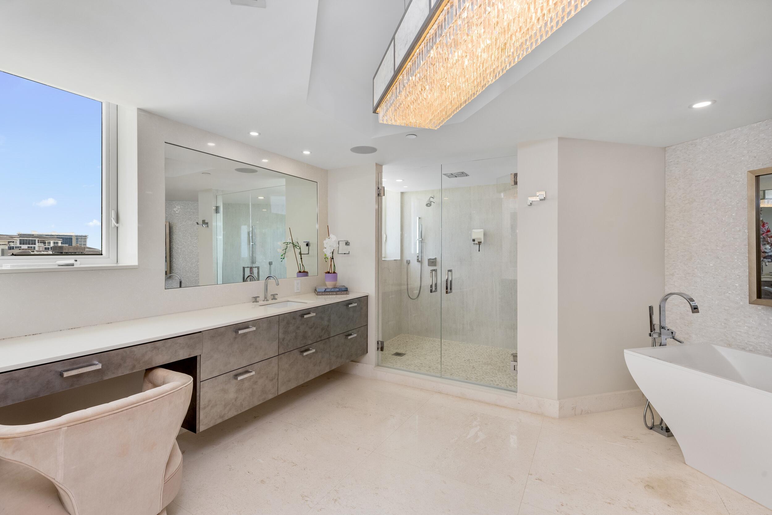 800 South Ocean Boulevard, Unit PH6 Boca Raton, FL 33432 - Photo 42 of 69 a bathroom with a bathtub shower sink double and mirror
