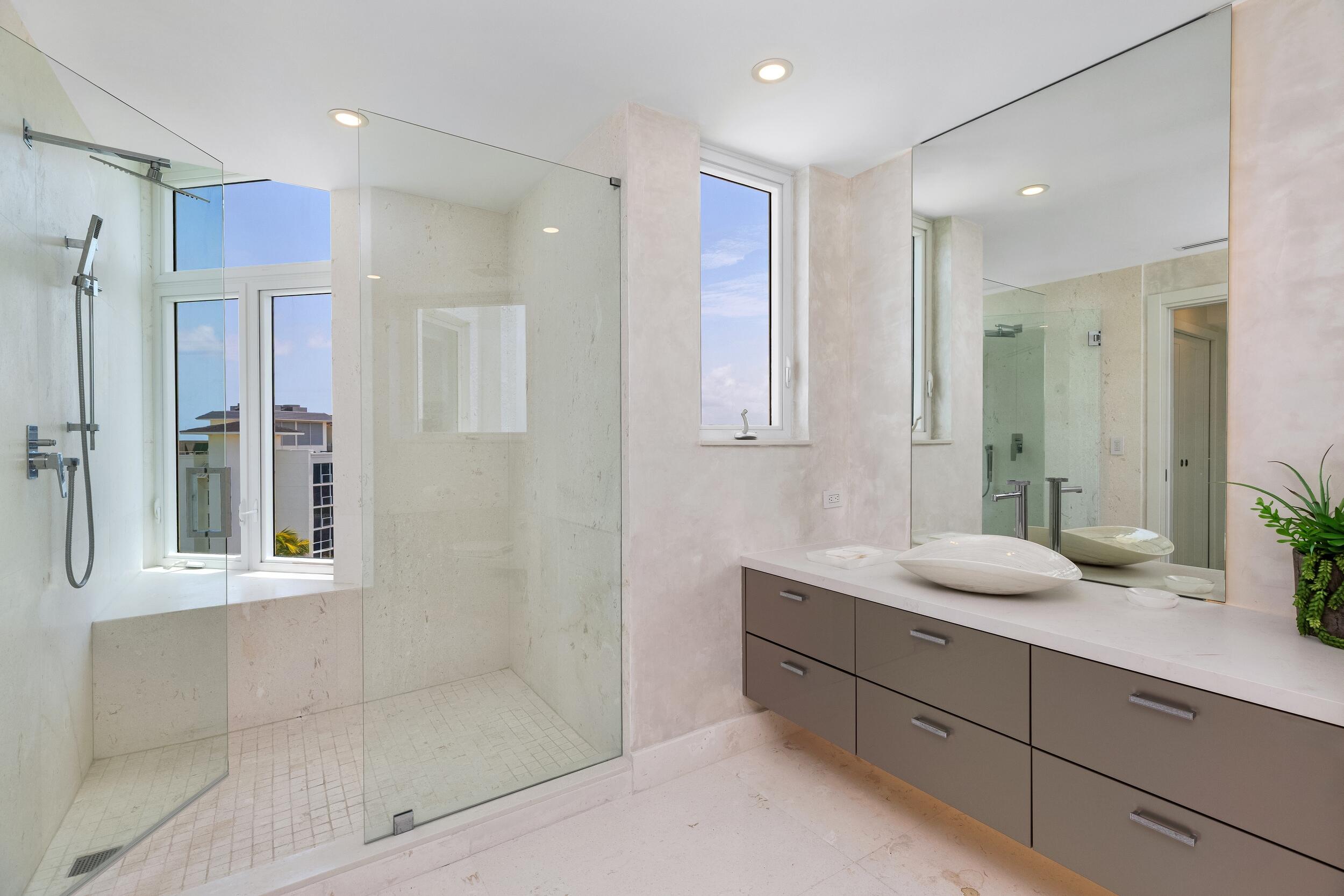 800 South Ocean Boulevard, Unit PH6 Boca Raton, FL 33432 - Photo 48 of 69 a bathroom with a double vanity sink mirror and shower