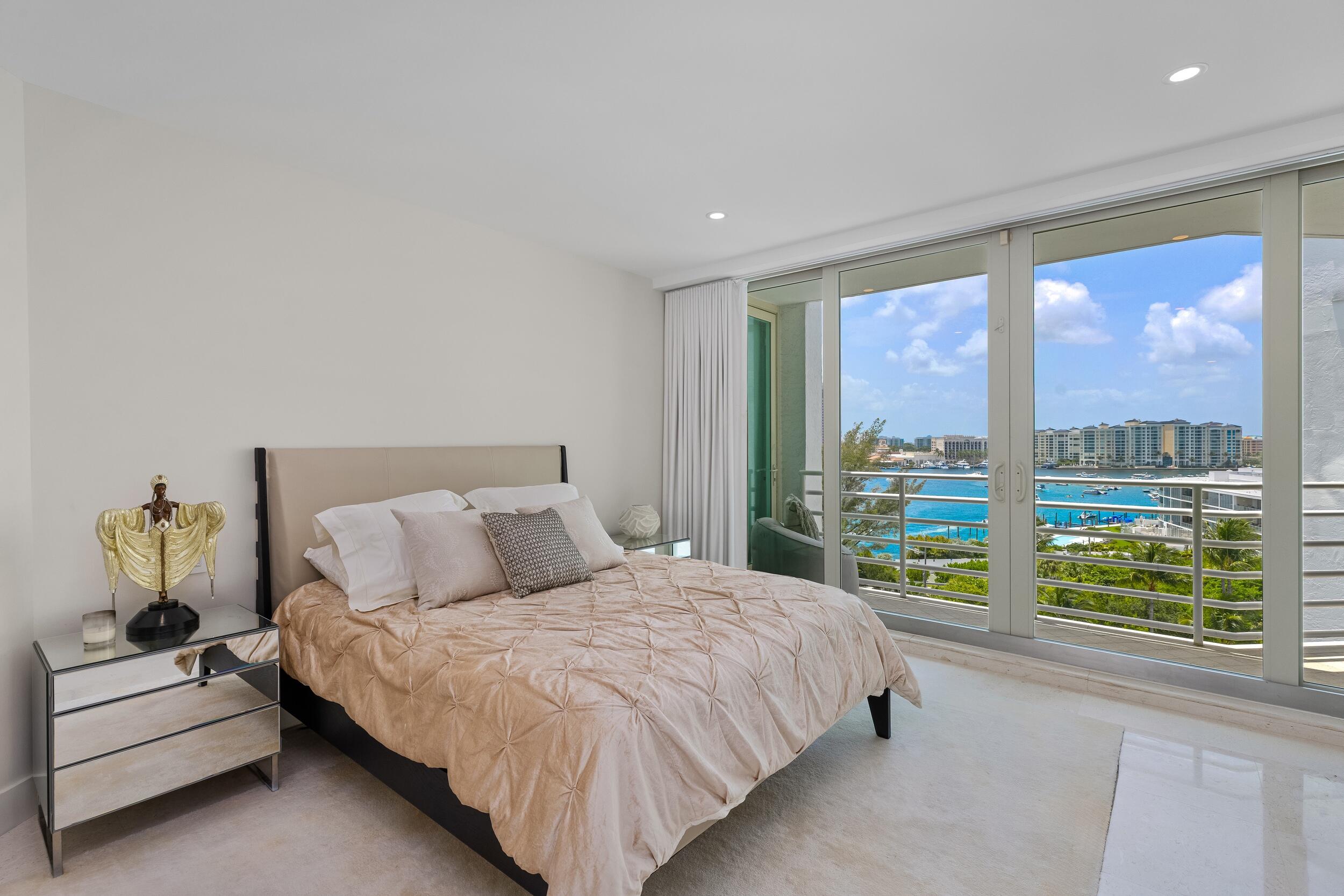 800 South Ocean Boulevard, Unit PH6 Boca Raton, FL 33432 - Photo 49 of 69 a bedroom with a large bed and a view of balcony