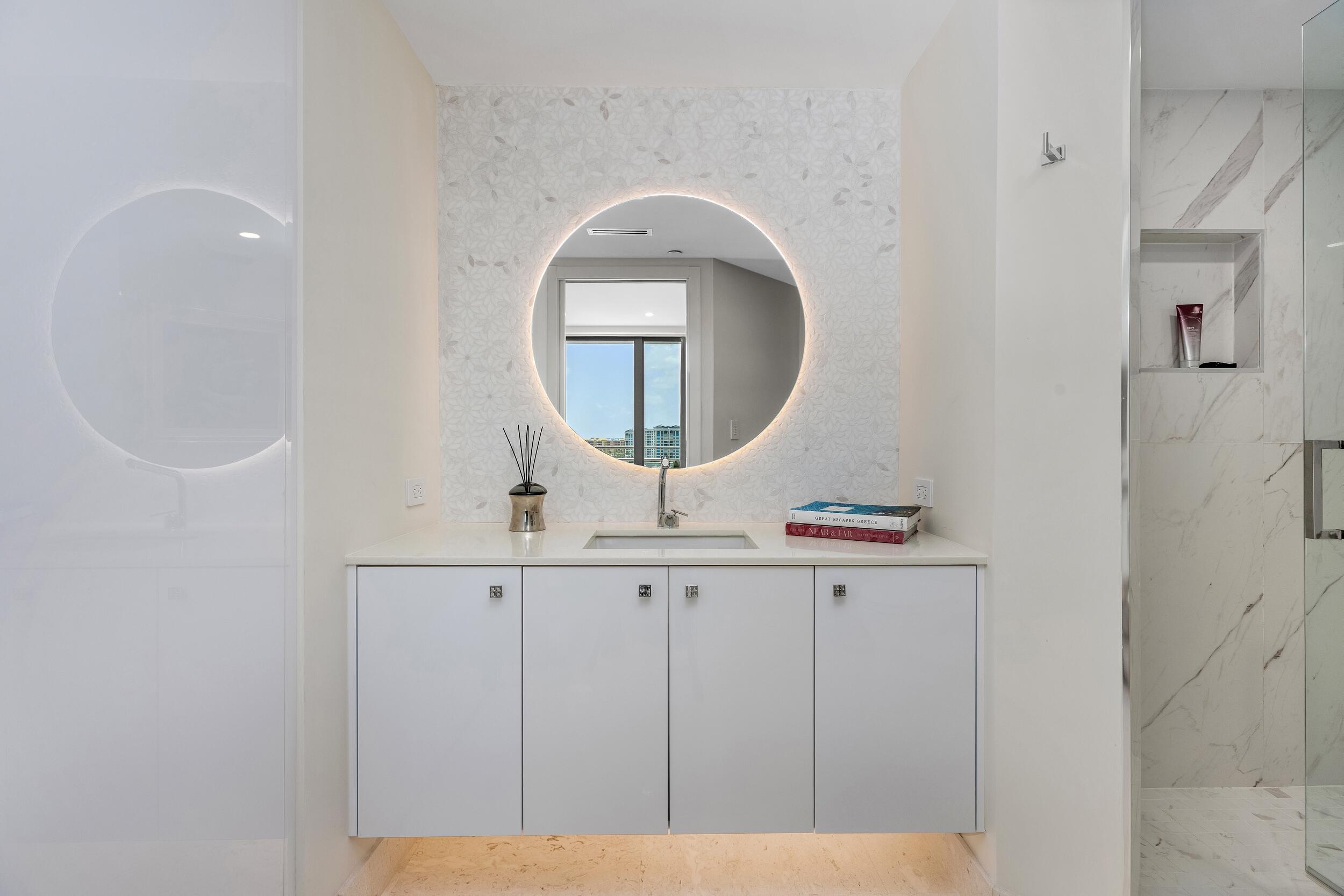 800 South Ocean Boulevard, Unit PH6 Boca Raton, FL 33432 - Photo 51 of 69 a bathroom with a sink a mirror and vanity