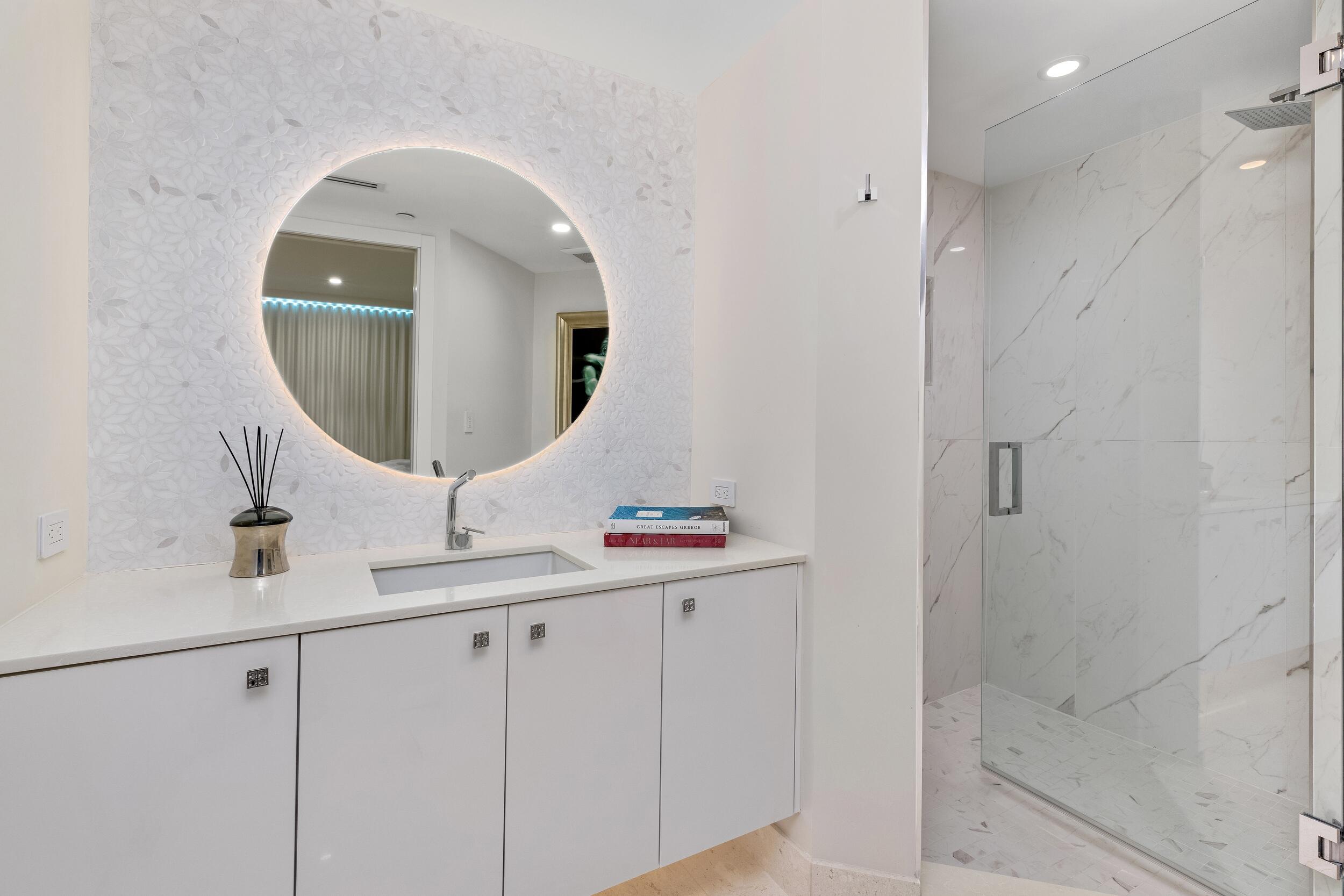 800 South Ocean Boulevard, Unit PH6 Boca Raton, FL 33432 - Photo 52 of 69 a bathroom with a sink and mirror