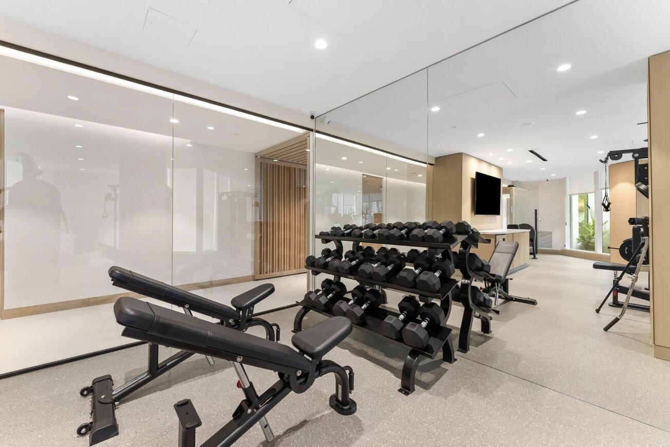 800 South Ocean Boulevard, Unit PH6 Boca Raton, FL 33432 - Photo 68 of 69 a room with gym equipment and mirrors
