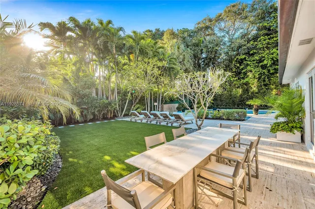 a view of yard with patio and green space