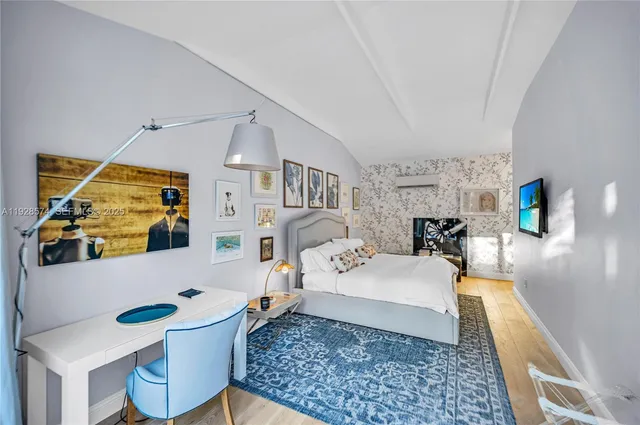 a bedroom with a bed a large window and book self