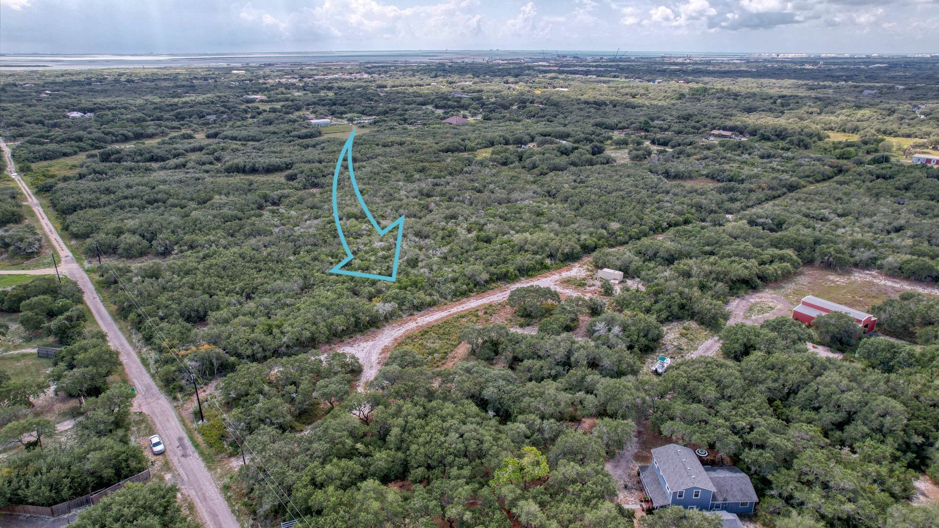 0 West Rhodes Avenue Aransas Pass, TX 78336 - Photo 15 of 25 a view of a forest with a street