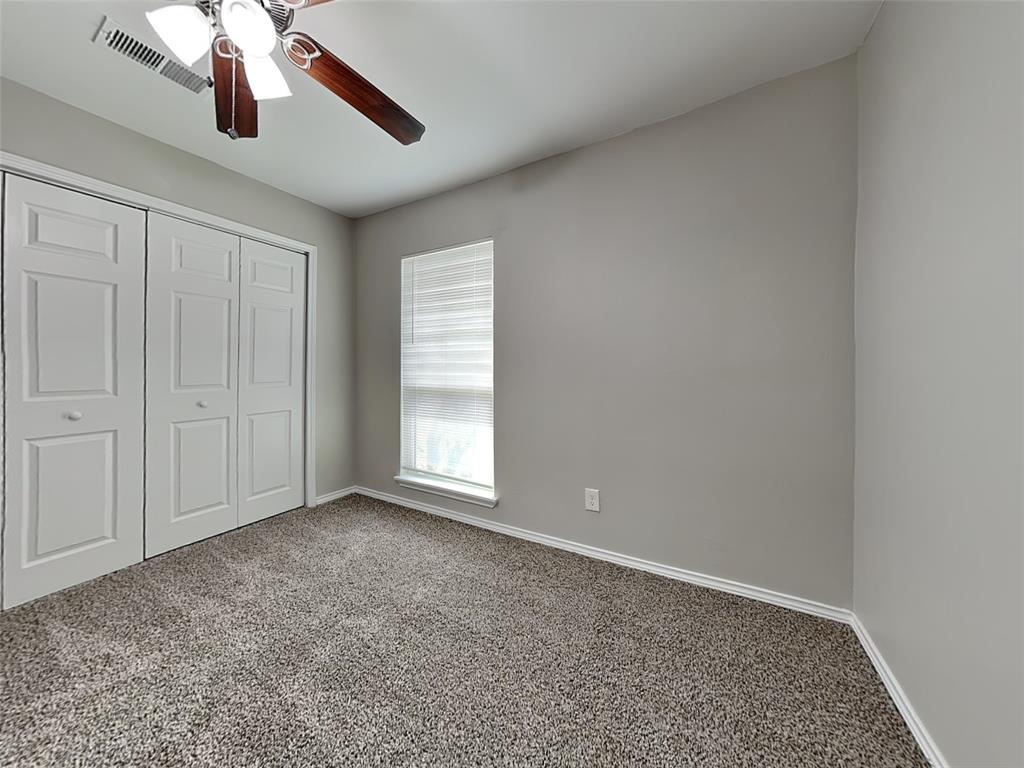 7621 Pebble Beach Drive Rowlett, TX 75088 - Photo 17 of 20 an empty room with chandelier fan