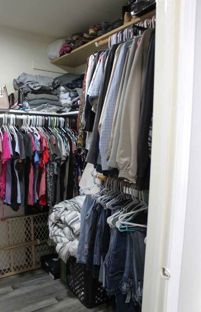 908 Glenmore Lane Elgin, IL 60124 - Photo 19 of 50 a view of walk in closet with clothes and shoes