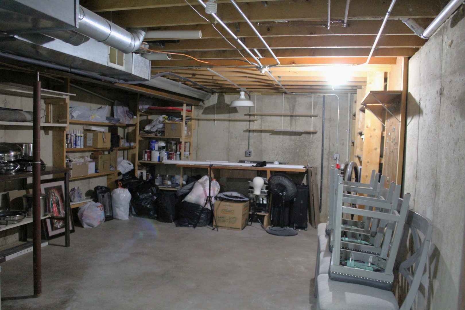 908 Glenmore Lane Elgin, IL 60124 - Photo 35 of 50 a view of a storage room with racks