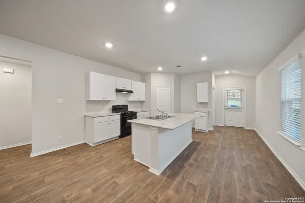 a view of kitchen with sink and microwave